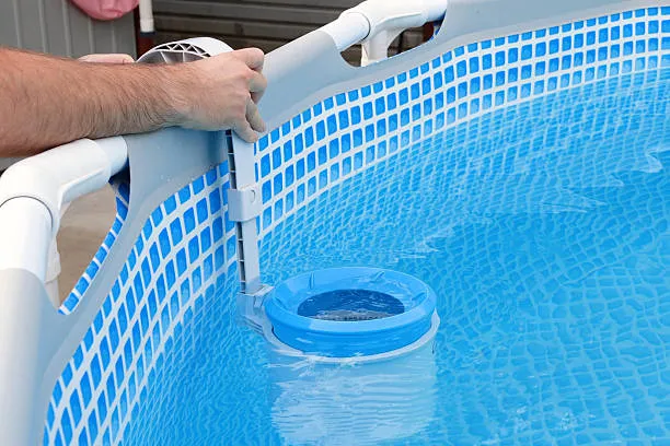 a man cleaning contaminated pool